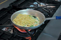 Finally, add the spaghetti well cooked in salted water and the white sauce from Japan. Fry and toss all ingredients thoroughly. Dish up and sprinkle it with chopped Chinese parsley