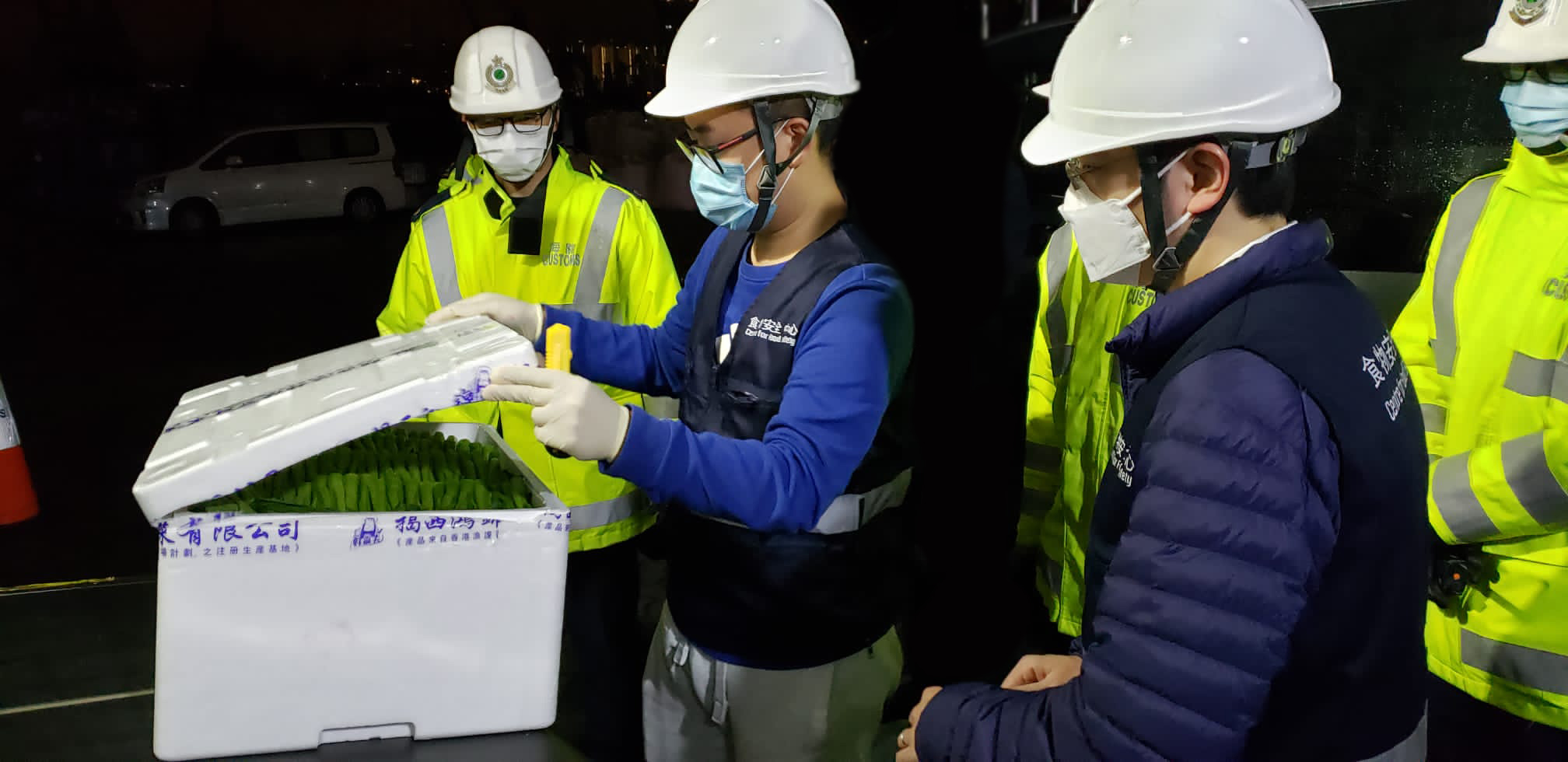Figure 3: CFS staff conducting food inspections at one of the temporary food inspection checkpoints