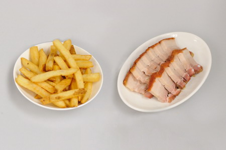 Examples of process contaminants produced by dry-heat cooking include acrylamide in French fries and PAHs in roasted pork