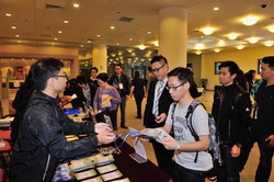 Participants registering at the front desk